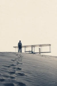 A lone figure beside an early glider on sand dunes, symbolizing Productive Failure and learning a way forward through uncertain attempts.