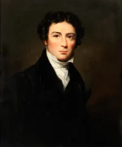 Portrait of Michael Faraday with dark, wavy hair, wearing a black coat and white cravat against a brown background.